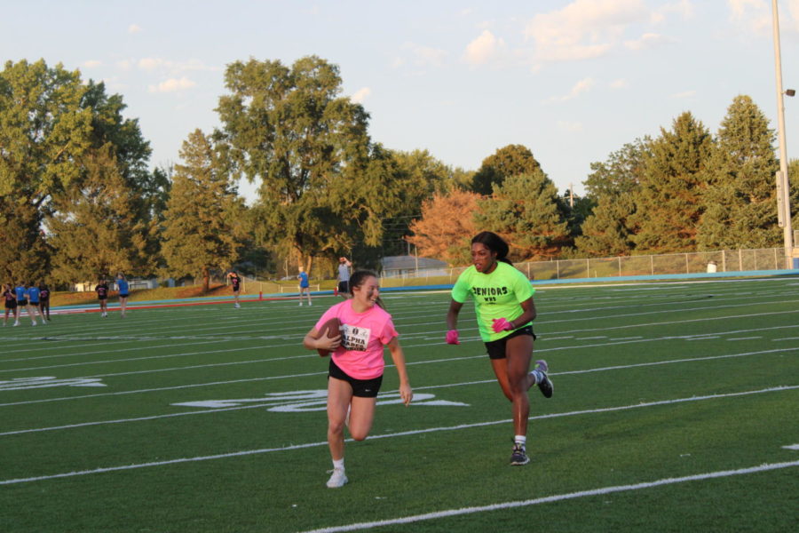 Savannah Ringheden running through the 20 yard line with Sahara Williams right behind. 