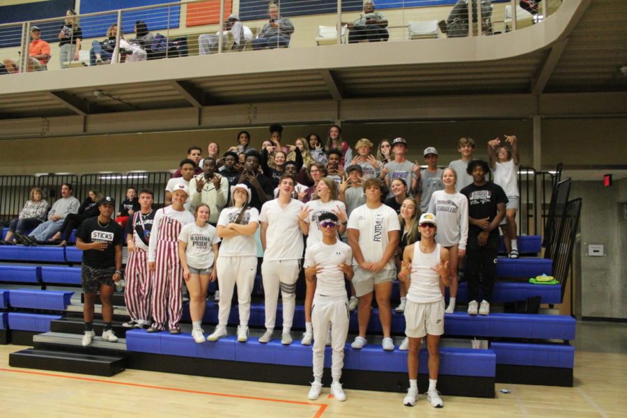 Students of West High attend the Girls Volleyball game dressed in the spirit out theme.