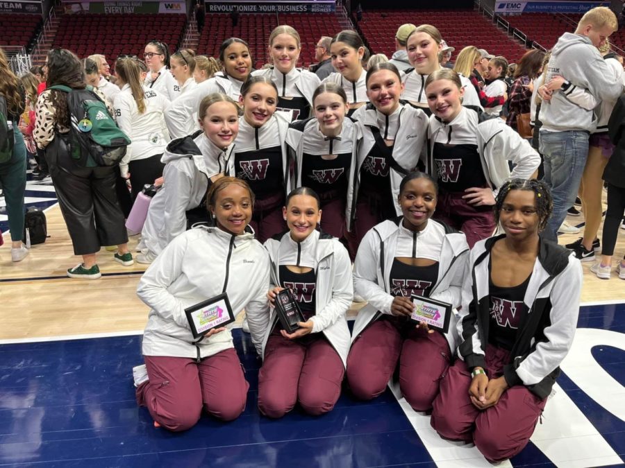 Dance team members pose together after the competition
