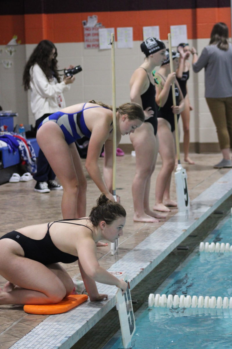 Addy Judas (East) Counts laps for the 500 Yard Freestyle.