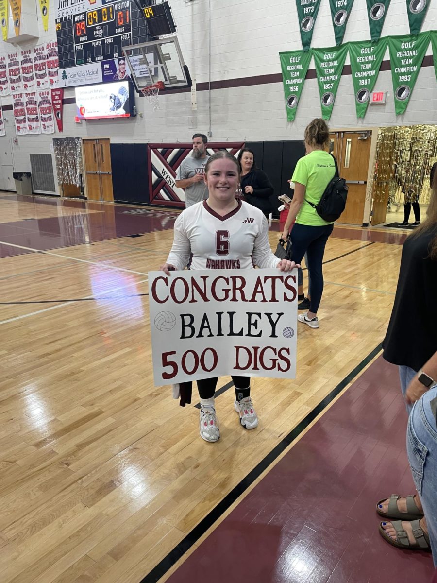 Bailey Schoepske with her 500 Digs poster.
