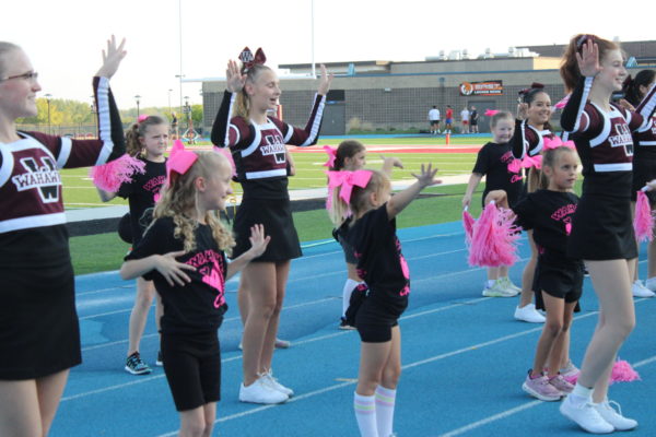 The cheerleaders and Kids dance to the song Beauty and a Beat by Justin Bieber.