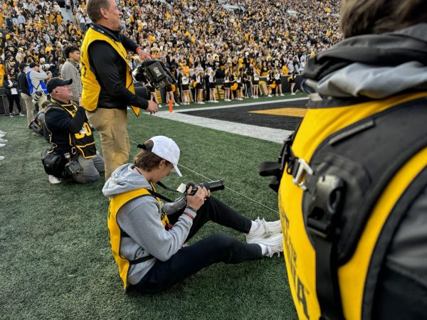 Talan Nelson photographing the University of Iowa football game against Purdue on Oct. 7 2023.