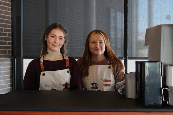 Junior Bailey Kestel and Savvy Bean owner Savannah Warren at the Savvy Bean cart in the Waterloo Career Center after the grand opening on January 22. 