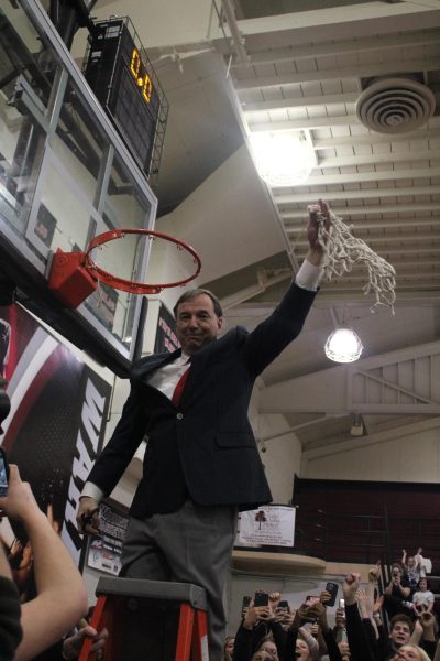 Dr. Pappas celebrates after solidifying a trip to the State Basketball tournament.  