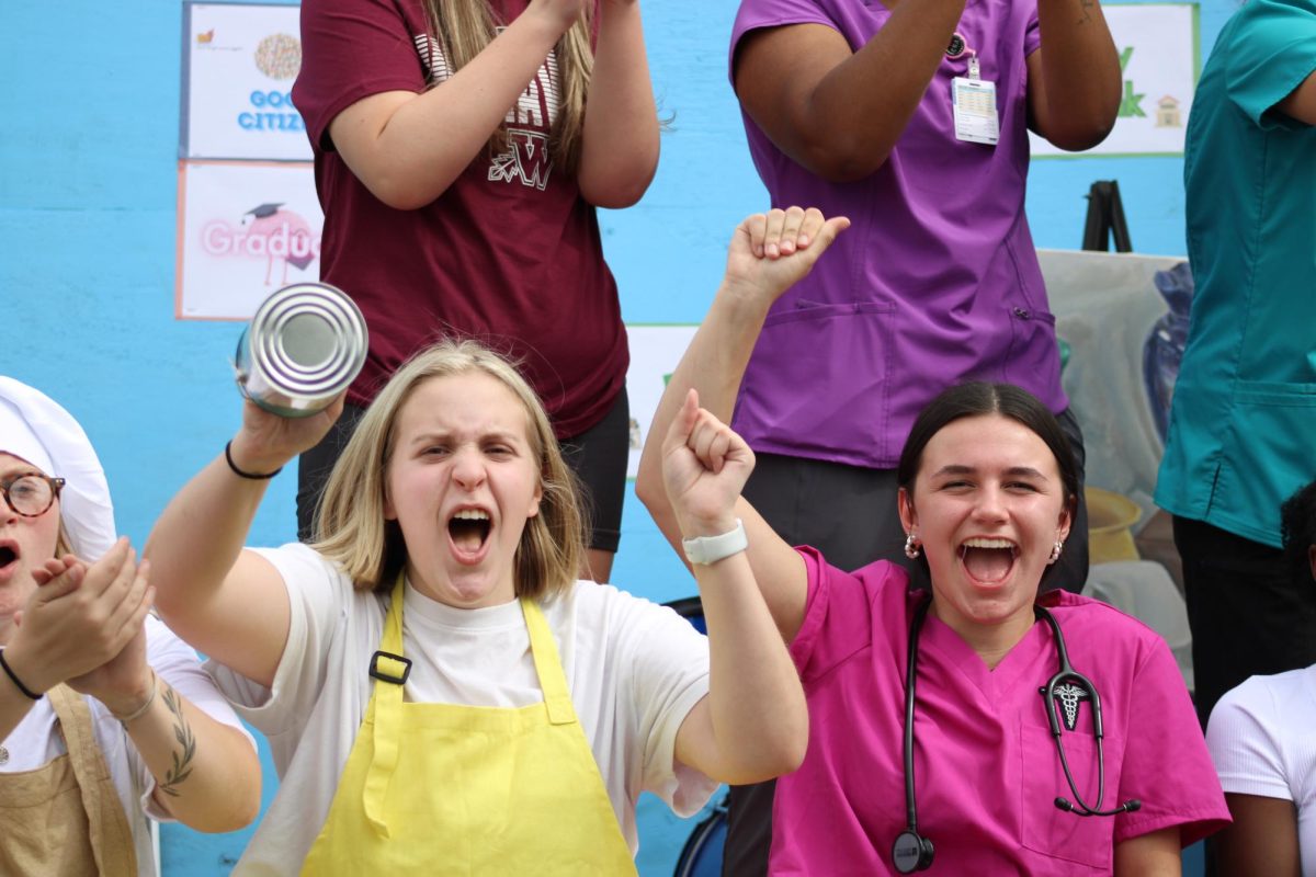 Seniors Izzy Rand and Jayna gomez hyping up the crowd during the parade 