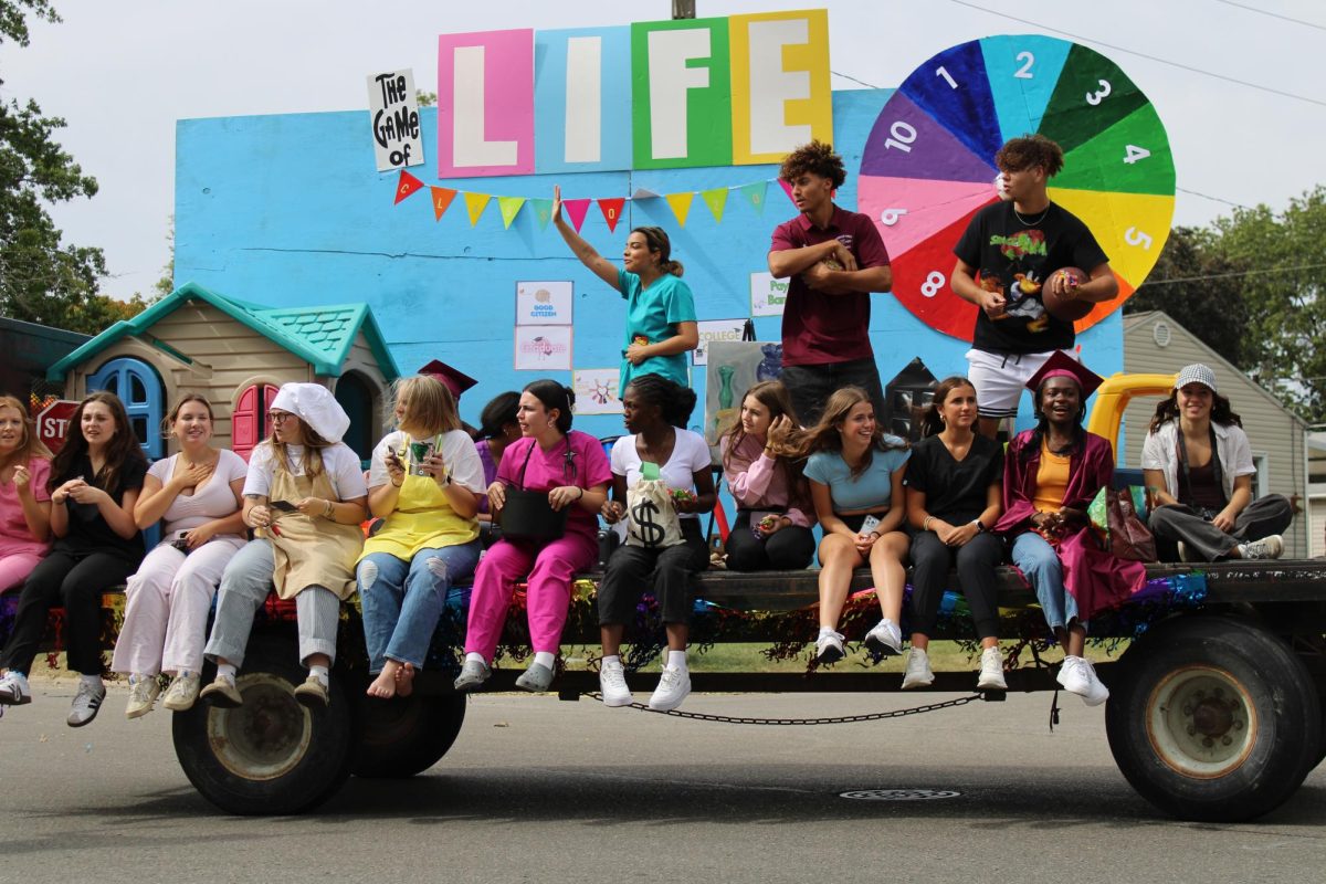 Seniors demonstrating school spirt with their winning float