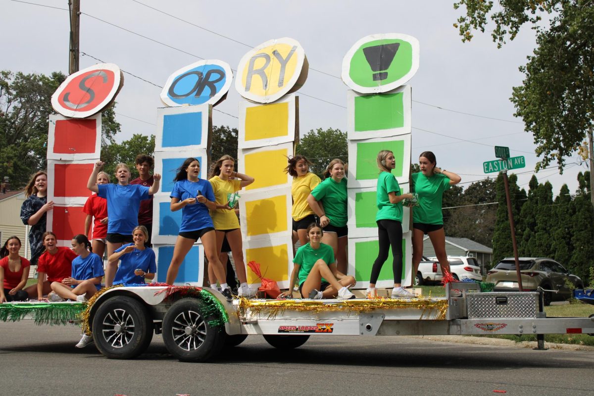 Enthusiastic  freshmen participating in homecoming parade for the first time