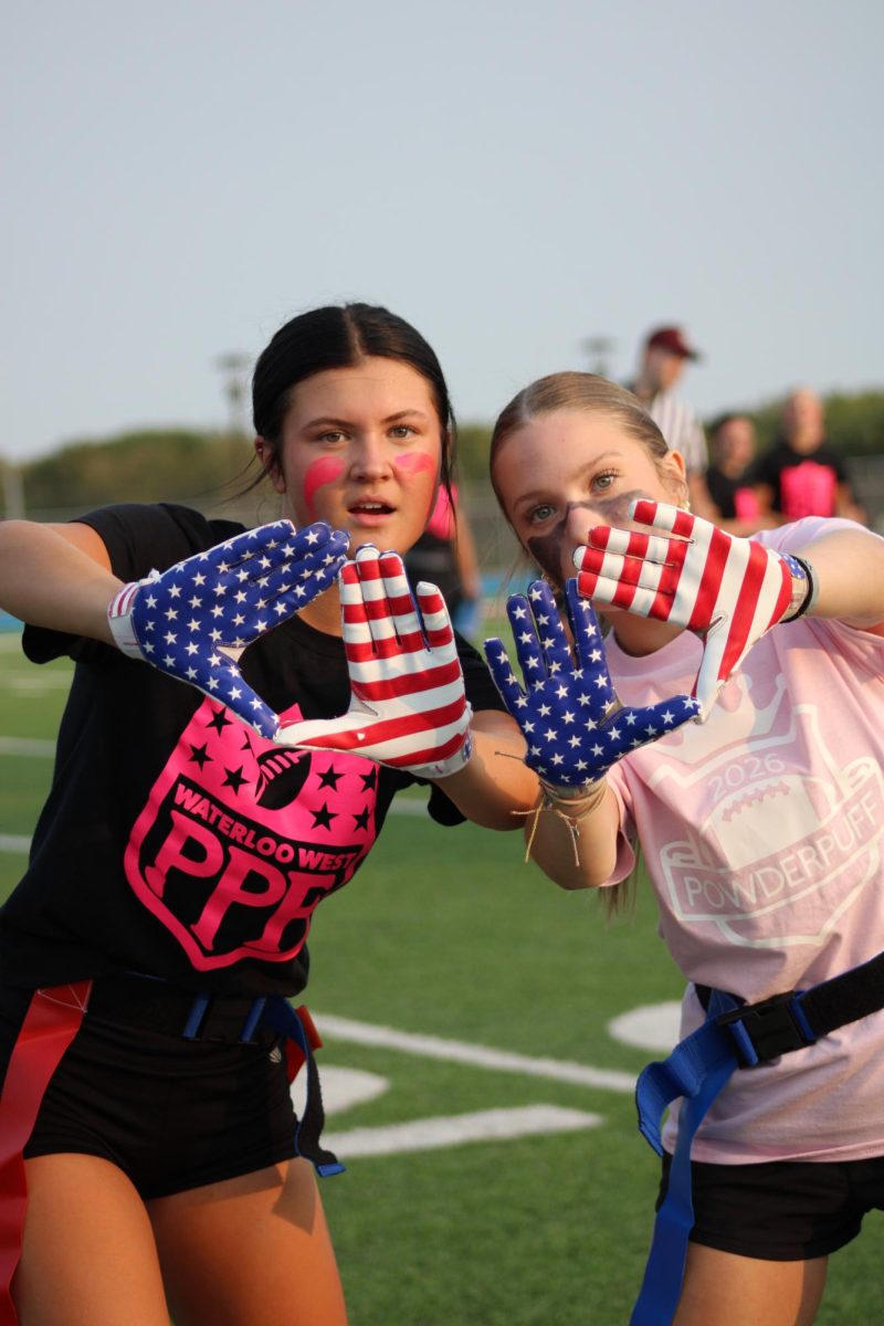 Senior Emma Beckman and Junior Lucy Jolley posing together. Even throughout a tough game, friendships still remain strong.