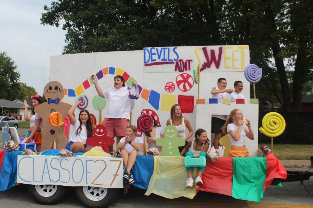 Sophomores showing their enthusiasm for their homecoming float