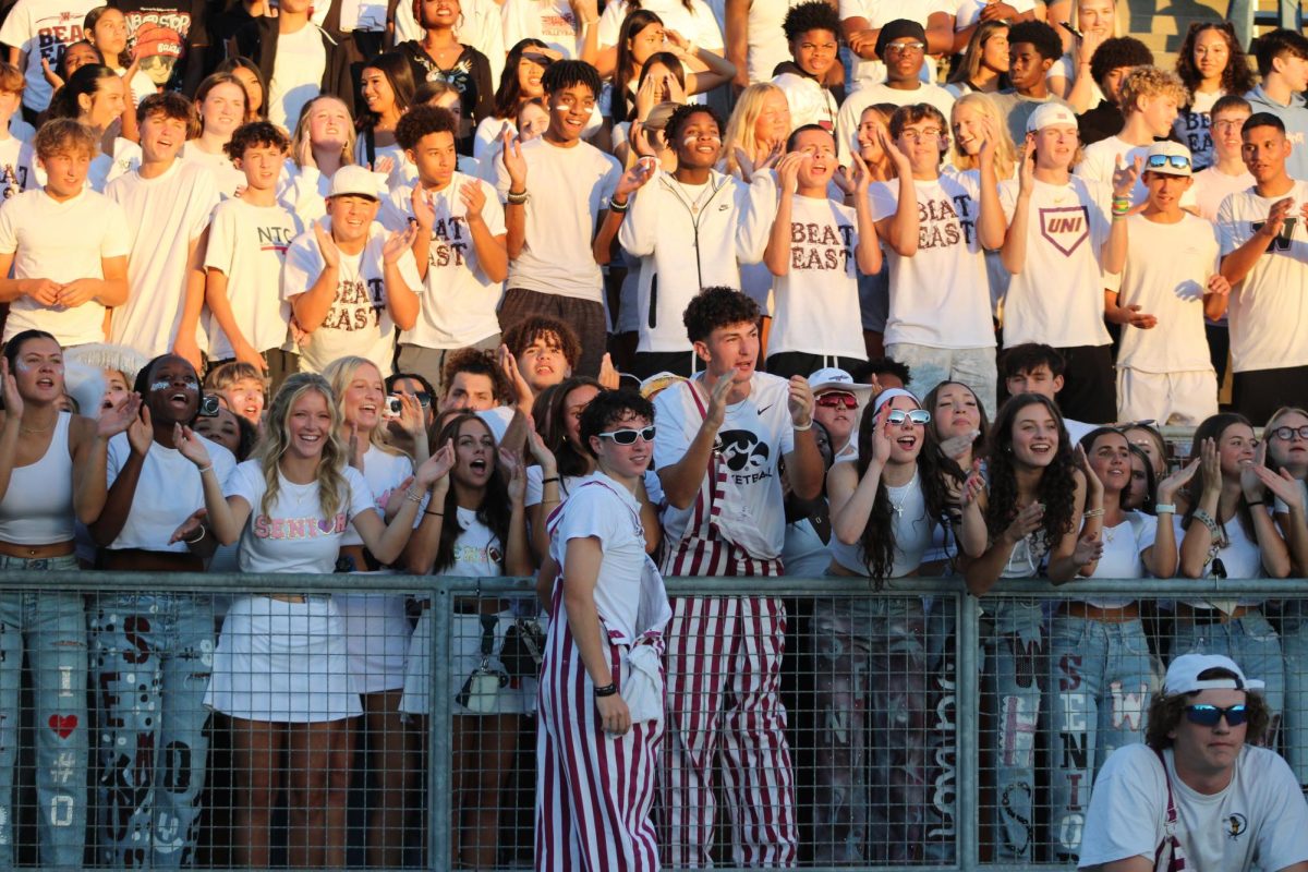 The West High Wahawk student section supports the Football players at Memorial Stadium for their game against their cross-town rival, East High.