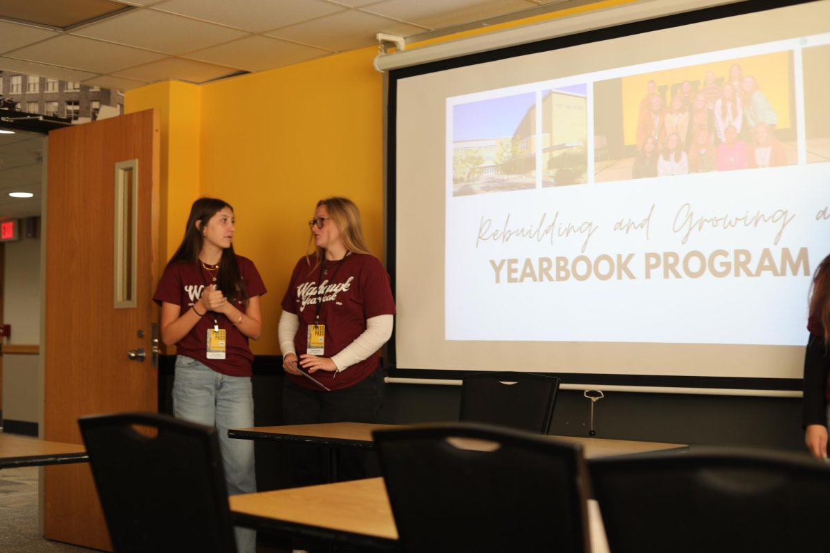 Emily Dadigan and Reagan Westphal presenting at the Wahawk Yearbook's session "Rebuilding and Growing a Yearbook Program."