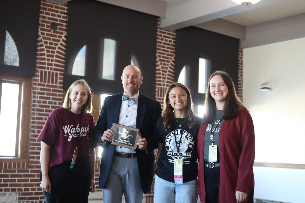 Jayna Gomez, Dr. Miehe, Kaylynn Crawford and Nicole Goodman smile for the award of Administrator of the Year. 