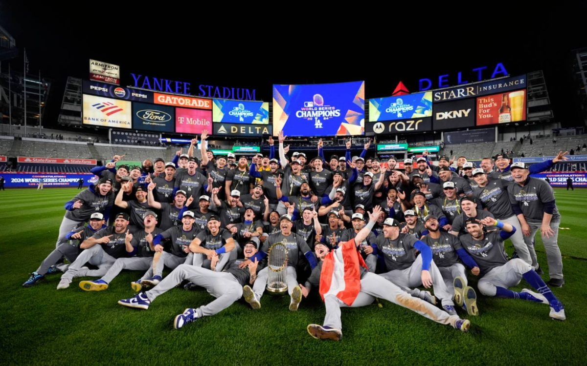 The Los Angeles Dodgers pose for their picture as they win the 2024 World Series