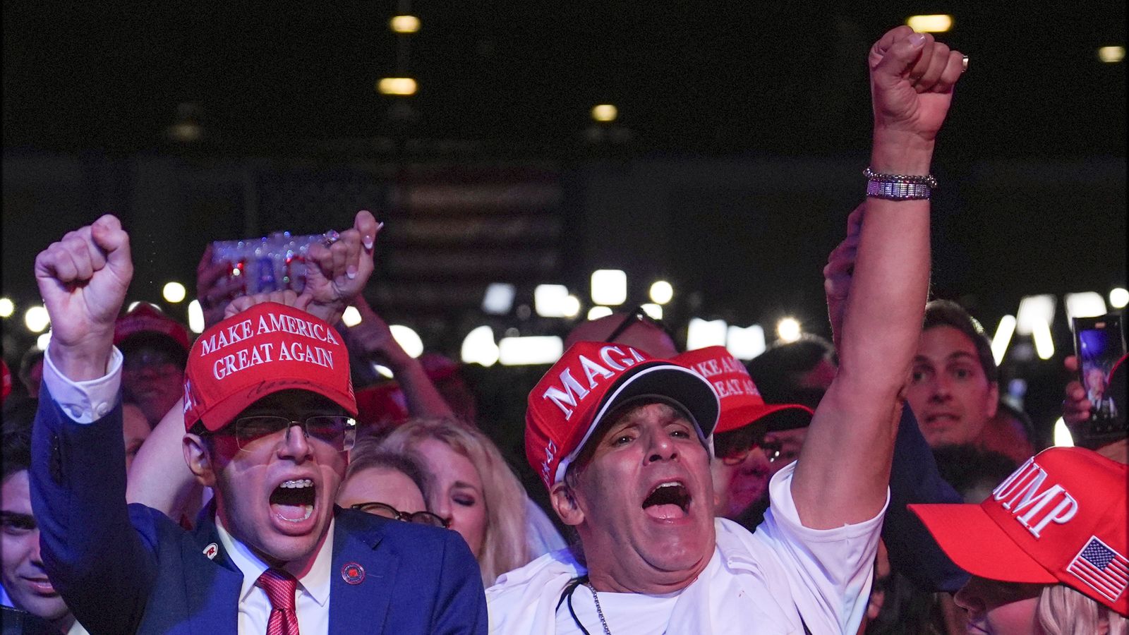 MAGA supporters cheering for Trump and a electoral victory. 