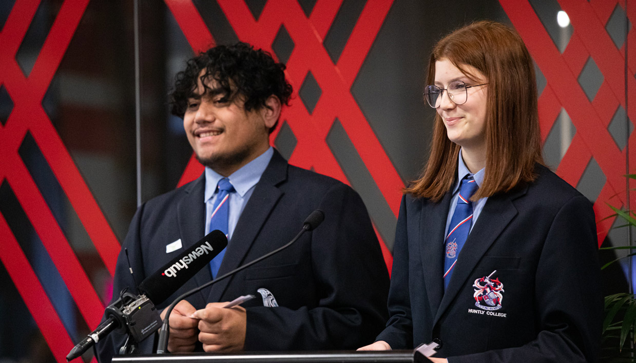 Students speaking at an event