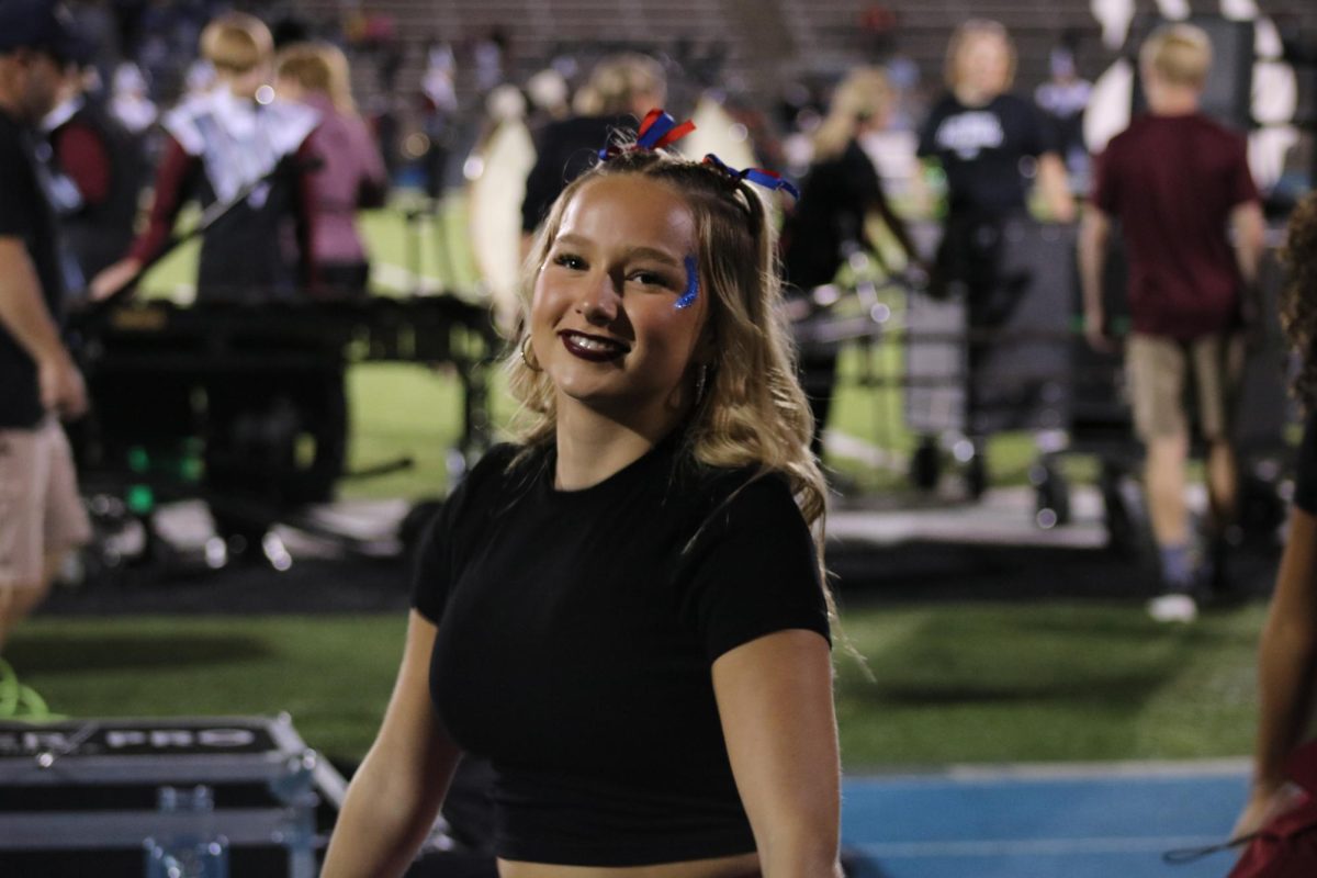 Abbie Verbraken  smiles for the camera at a Friday night football game