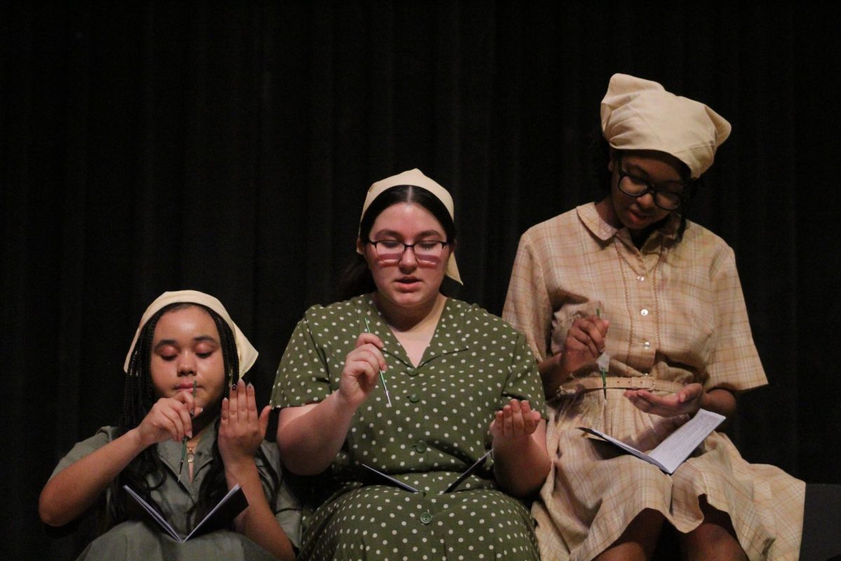 Jan. 23, 2025, West Highschool held a Large Group showcase for families not able to make it to performances. Delphi, Brooklyn Berumez, Aerz Johnson are performing their Coral Reading called "Radium Girls". Their event was shown in the auditorium at West.