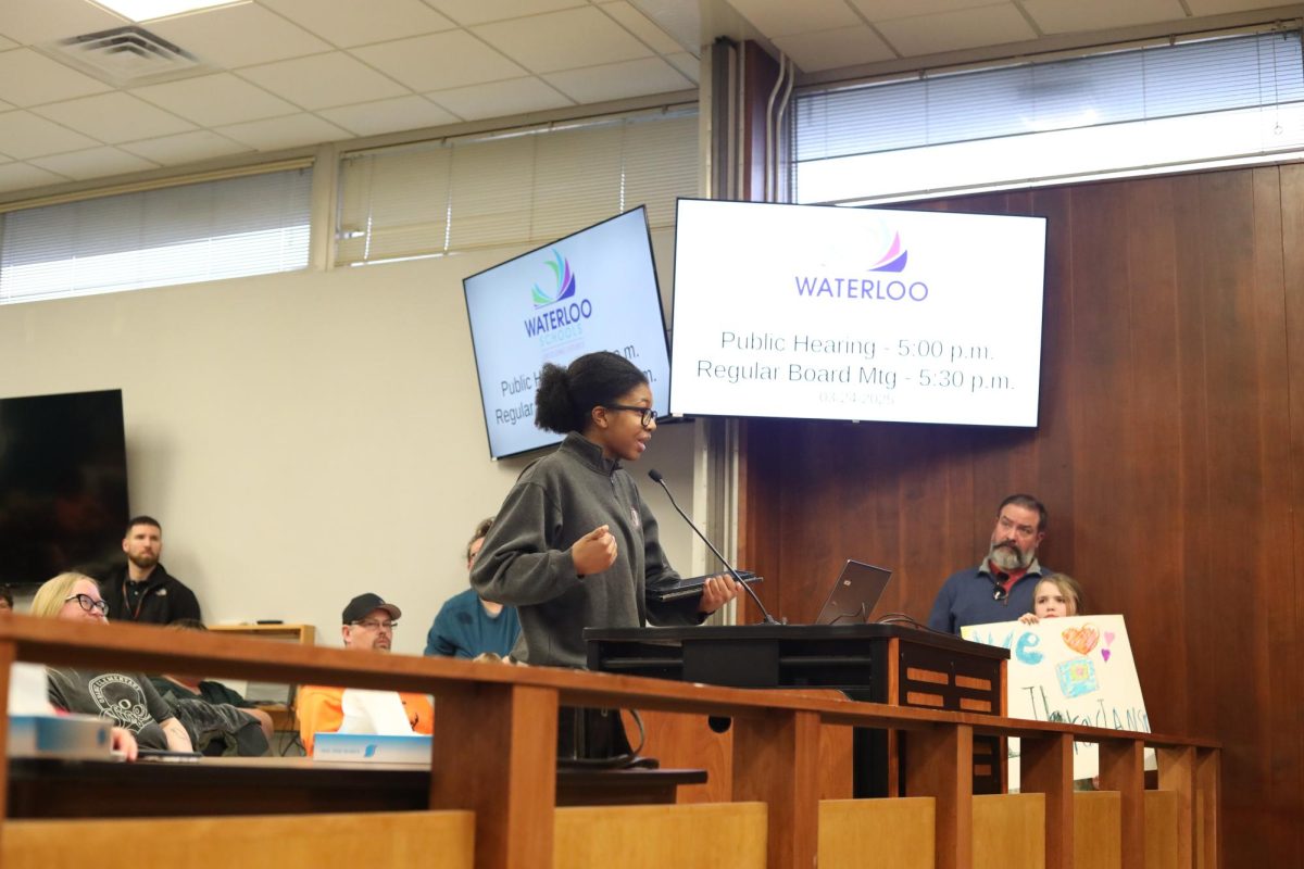 Aerz Johnson, a senior at West speaking at a school board meeting where budget cuts were announced. "Budget cuts affect students negatively because it's usually essentially resources being cut such as research materials," shares Johnson.

