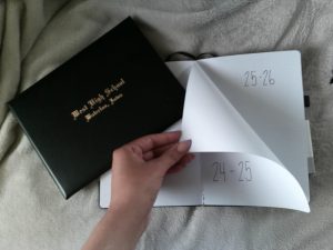 Turning a new page can be difficult, but you have to hold the hope that the next page can be better than the last. This pictures shows a High school diploma, as well as someone turning the page from 24-25 to 25-26.