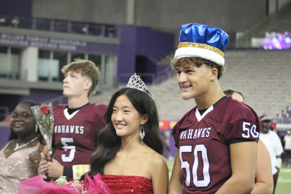 Melakhi Hickey and Esther Shin smile after being announced Homecoming King and Queen. 