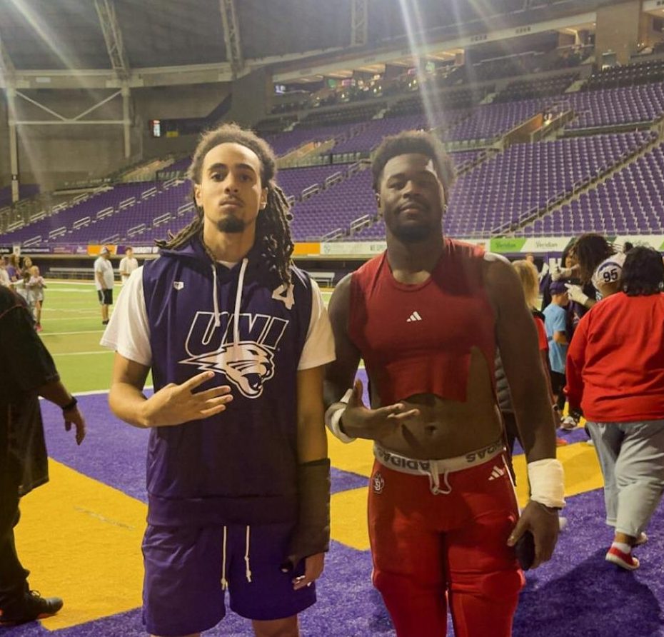Former Wahawks Nate Ewell and Tay Norman pose for a picture after South Dakota vs Northern Iowa football game. 