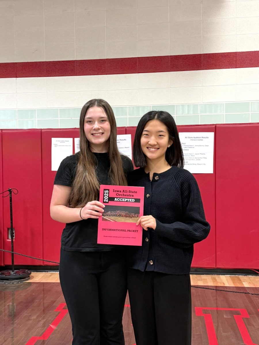 Senior Esther Shin smiles beside fellow All-Stater Phoebe Morgan. This is Shin's fourth and final year being accepted into the Iowa All-State orchestra. (Photo courtesy of Esther Shin)