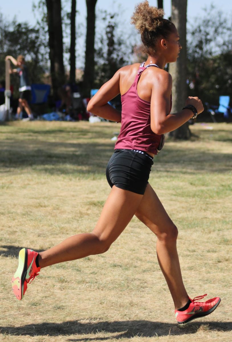 Ollivierre races towards the finish line at a meet in Waverly Iowa