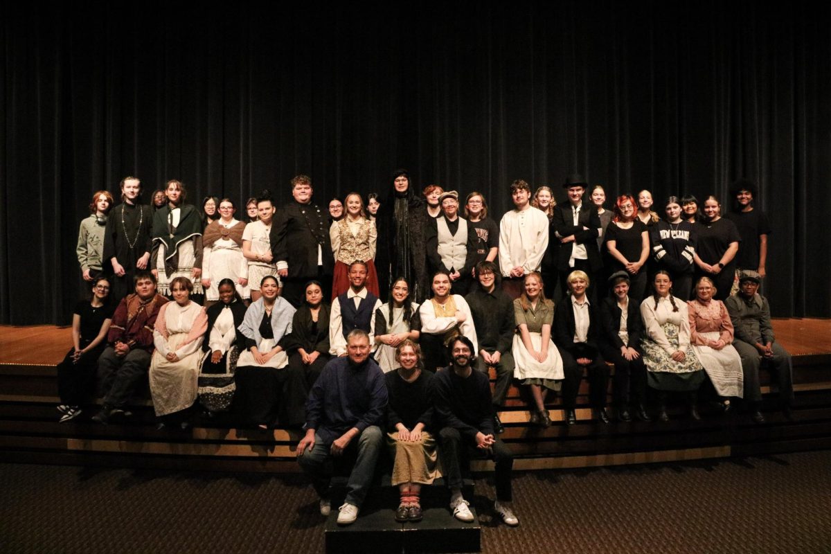 The cast, crew and directors of "The Legend of Sleepy Hollow" pose for a photo before their performance on November 7.