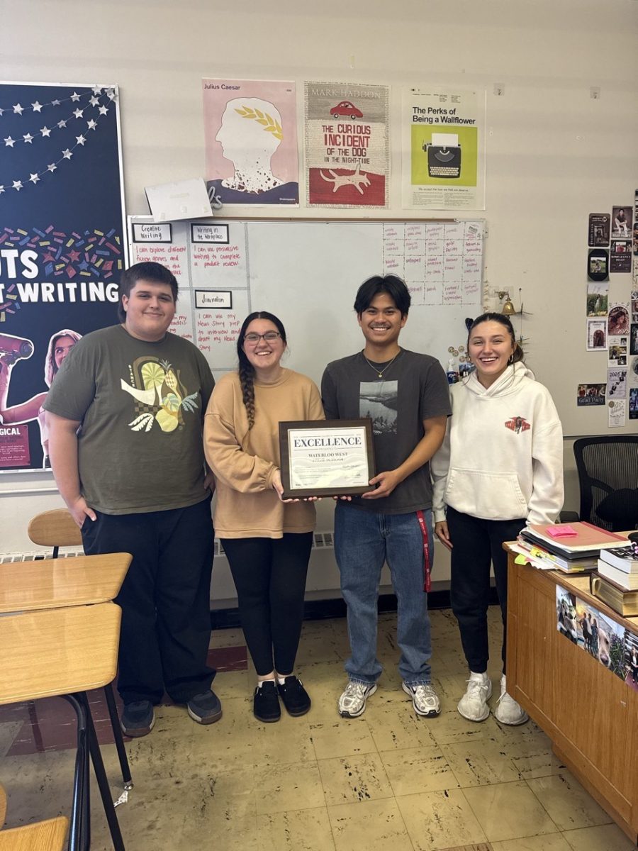 The 2025-2026 Yearbook editors pose with their prestigious award. "This award means the world to us because it just means that we're finally being recognized for all of the hard work that the four of us put into editing and that the work of last years' staff paid off enough for us to deserve this!" says Co-Editor-in-Chief Brooklynn Berumez. (Photo courtesy of Nicole Goodman)