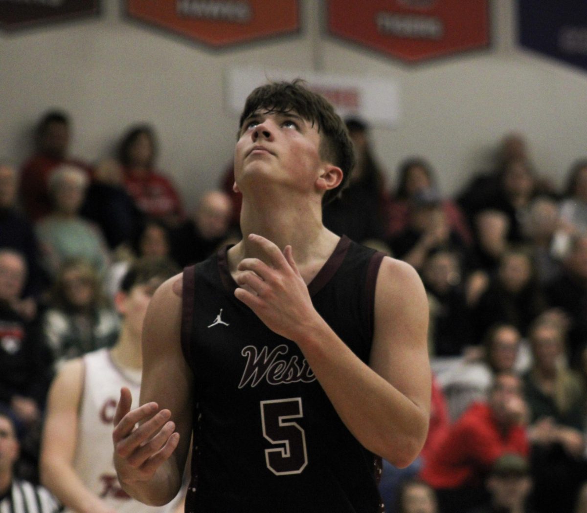 Sophomore Oliver Beckman looks up in defeat as Cedar Falls makes a basket.