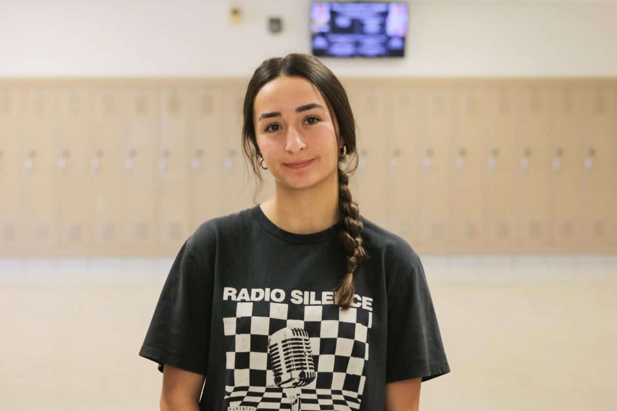 Adela Kantarevic poses for a photo in the hallway of West High School. 