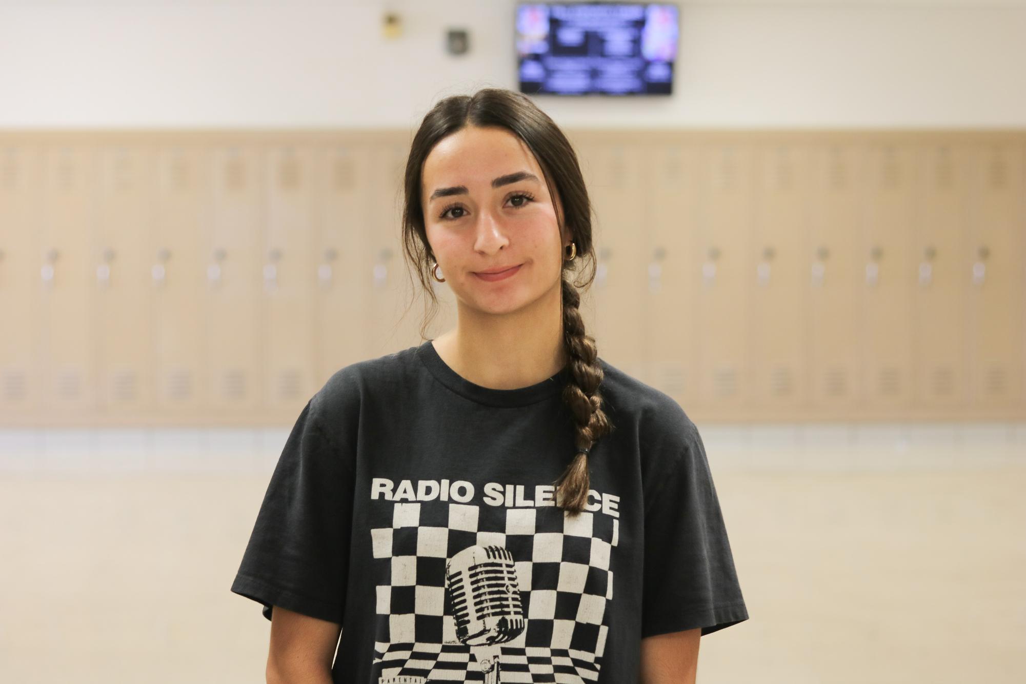 Adela Kantarevic poses for a photo in the hallway of West High School. 