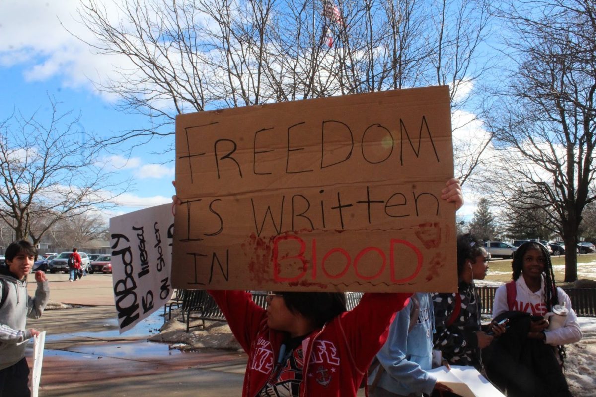 A student holds up a protest sign during the student walkout on February 6.