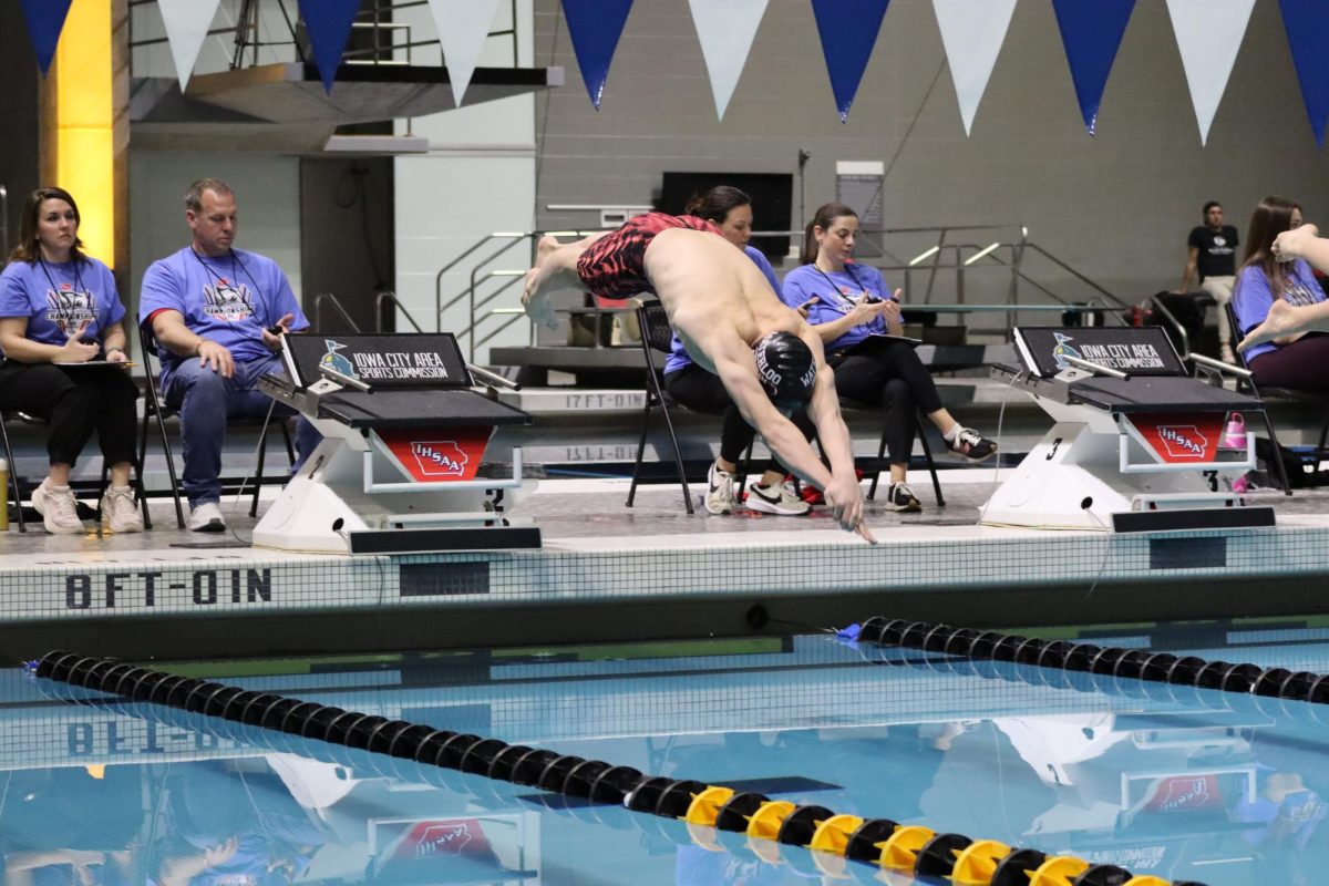 Freshman swimmer Simon Kline competing at the state swim meet