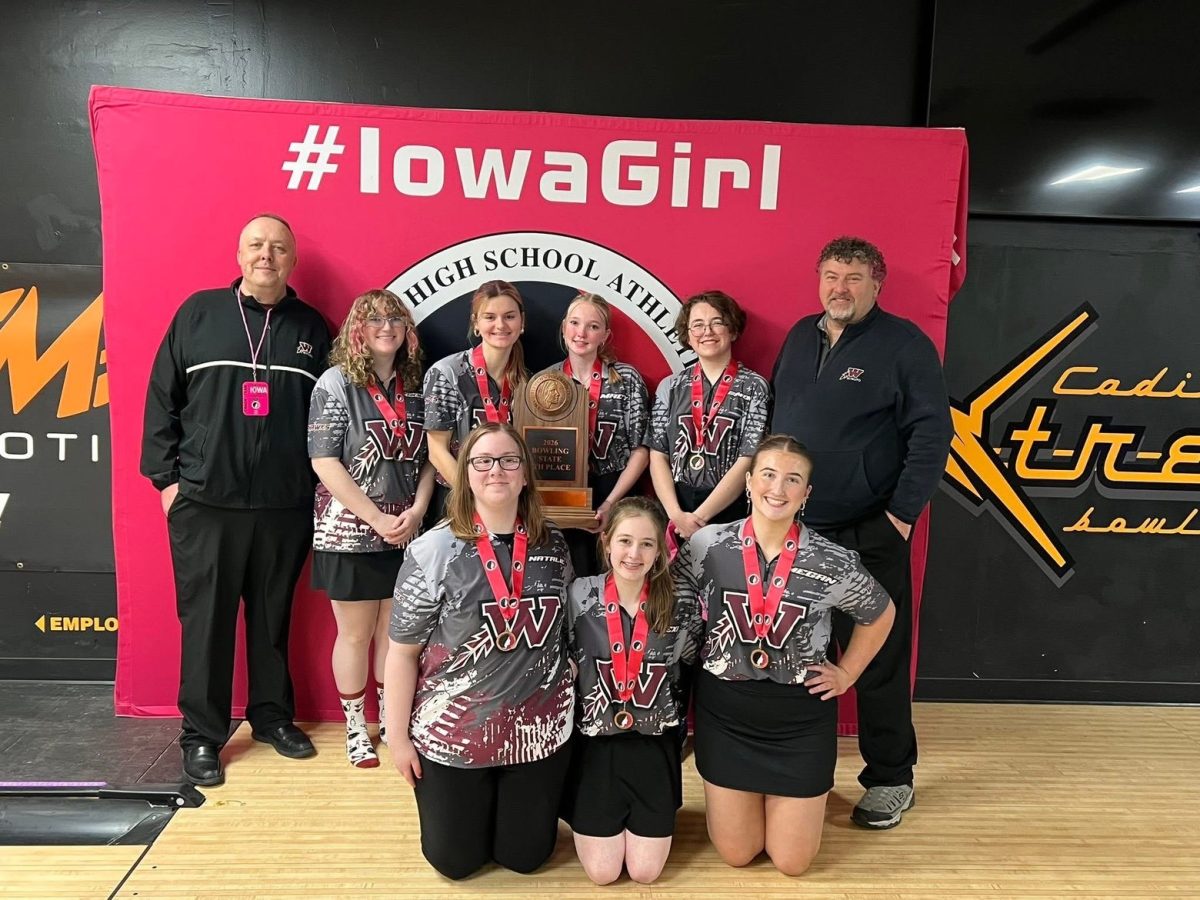 The girls team poses with there fourth place trophy after a long eventful day. 