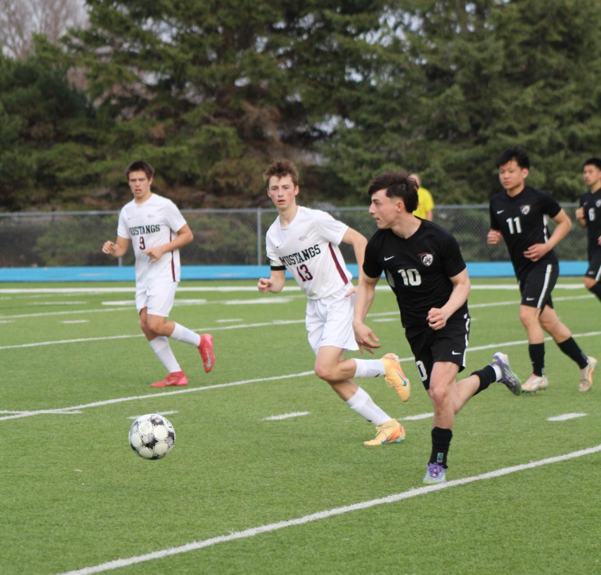Aidin Bajramovic makes a run down the field while defenders follow close. 