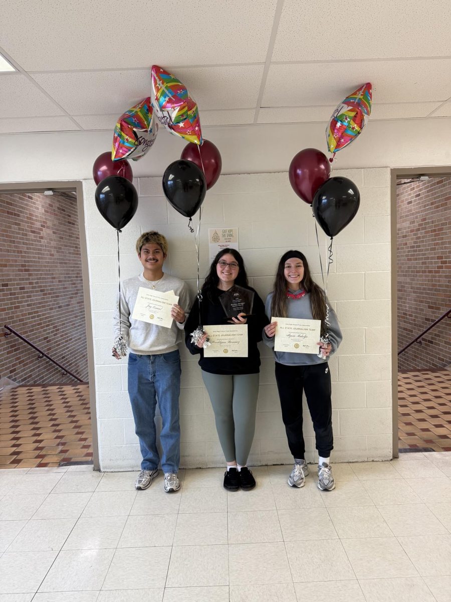 Jay Esmael, Brooklynn Berumez and Alyssa Muheljic pose with their certificates and balloons after being named members of the Iowa High School Press Association's Inaugural All-State Journalism Team.