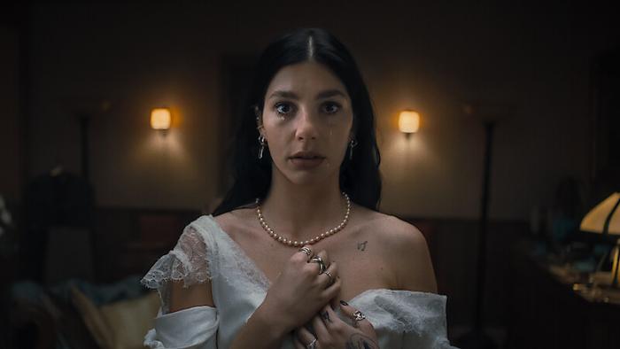 The series' main character, Rachel Harkin, in her cursed wedding dress.
-Photo courtesy of Netflix.