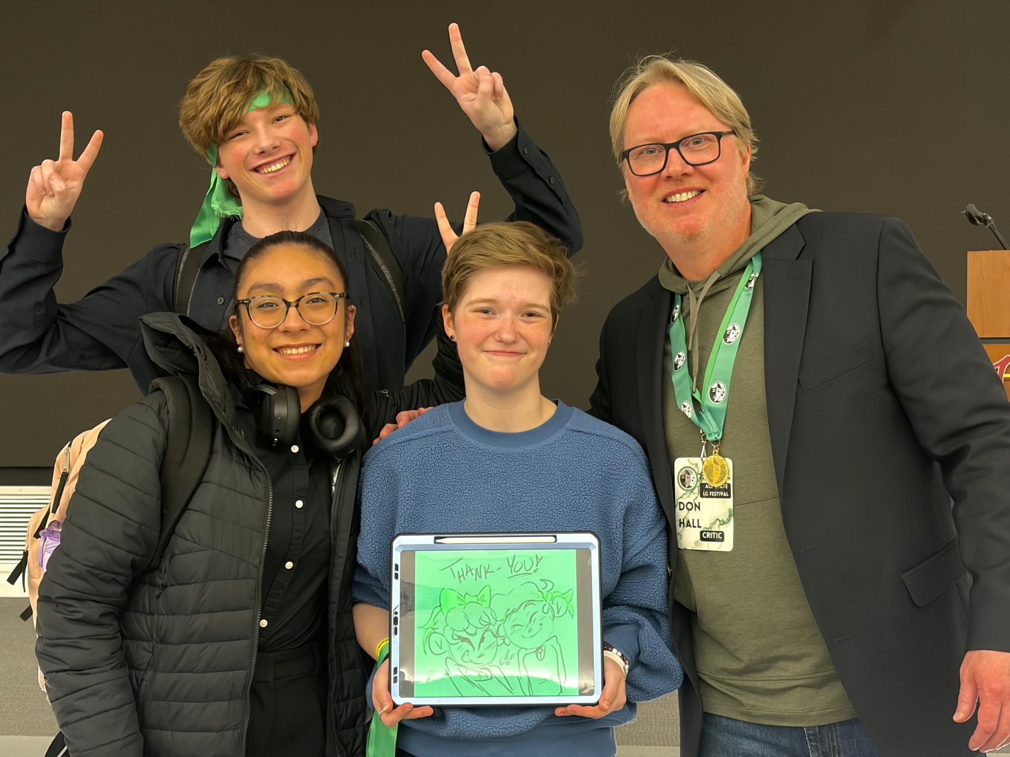 Short Film students Liam Ramsey, Sofia Gomez and Em Teare take a photo with Short Film Critic Don Hall at the IHSSA All-State Festival. Hall is an American animation film director, voice actor and screenwriter who is best known for directing the films Winnie the Pooh, Big Hero 6, Raya and the Last Dragon and Strange World, and co-directing the film Moana for Walt Disney Animation Studios. Photo courtesy of Em Teare.